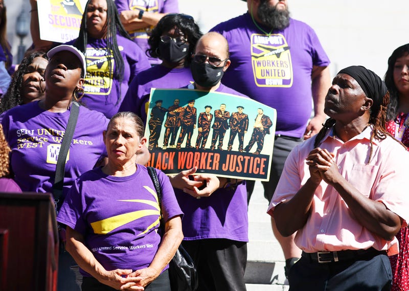 SEIU California union members stand at a demonstration outside City Hall calling for the resignations of L.A. City Council members Kevin de Leon and Gil Cedillo in the wake of a leaked audio recording on October 18, 2022 in Los Angeles, California.