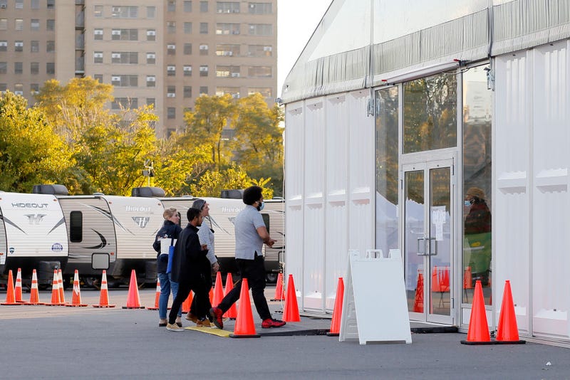 A migrant enters at the humanitarian relief center on Randalls Island on October 19, 2022 in New York City.