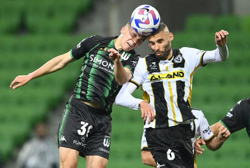 Noah Botic of Western United and Tomislav Uskok of Macarthur FC compete to head the ball during the round three A-League Men's match between Western United and Macarthur FC at AAMI Park, on October 21, 2022, in Melbourne, Australia.