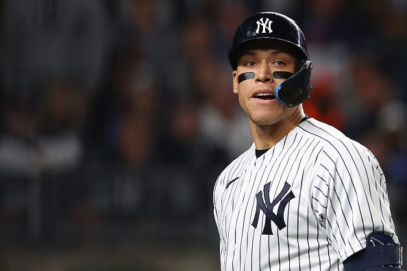 Aaron Judge models the Yankees home uniforms.