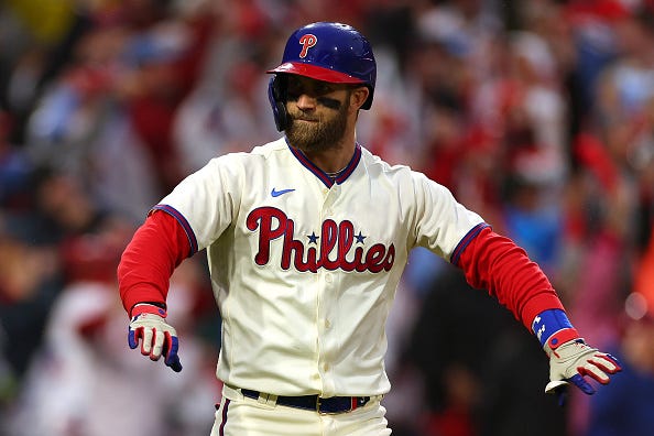 Bryce Harper models the Phillies alternate cream uniforms.