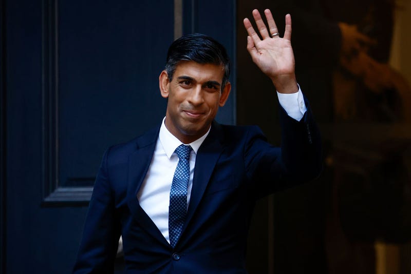 New Conservative Party leader and incoming prime minister Rishi Sunak waves as he departs Conservative Party Headquarters on October 24,2022 in London, England.