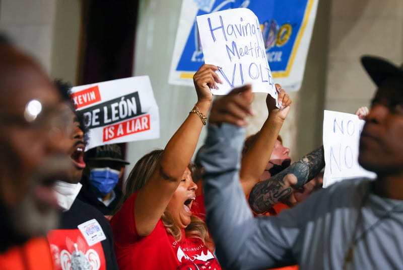 protesters in city council chamber