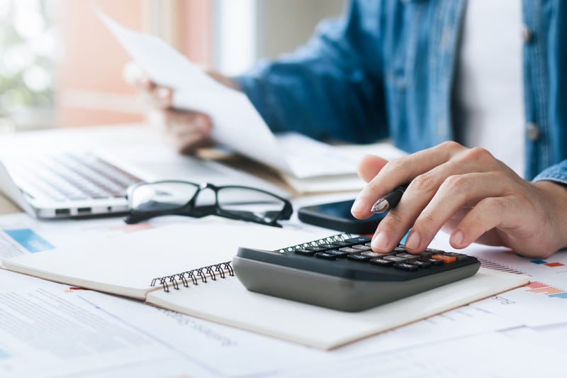 Person filling out tax forms