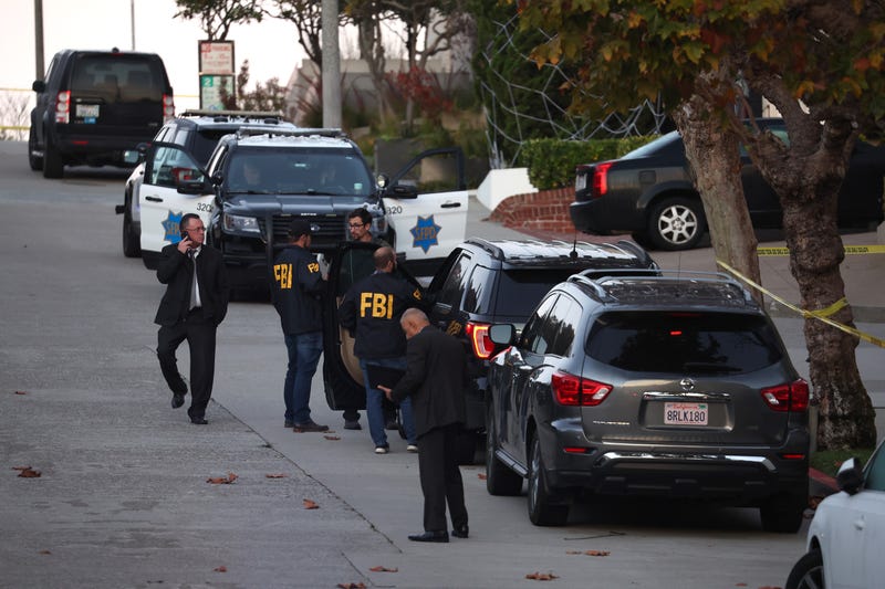 San Francisco police officers and F.B.I. agents gather in front of the home of U.S. Speaker of the House Nancy Pelosi (D-CA) on Oct. 28, 2022 in San Francisco, California