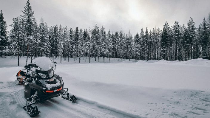 Man killed after snowmobile leaves trail, hits trees in Northern Michigan