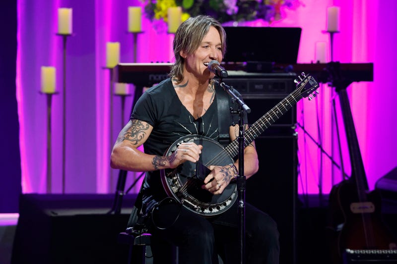 Keith Urban performs onstage during Coal Miner's Daughter: A Celebration of the Life & Music of Loretta Lynn at The Grand Ole Opry.