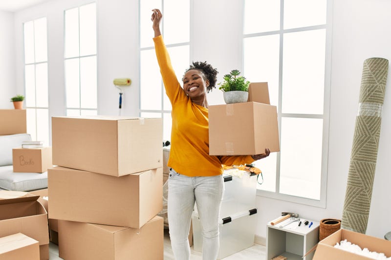 Woman celebrating moving into her new home.