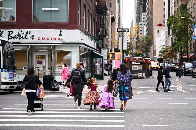 Trick-or-treaters are seen in Midtown Manhattan