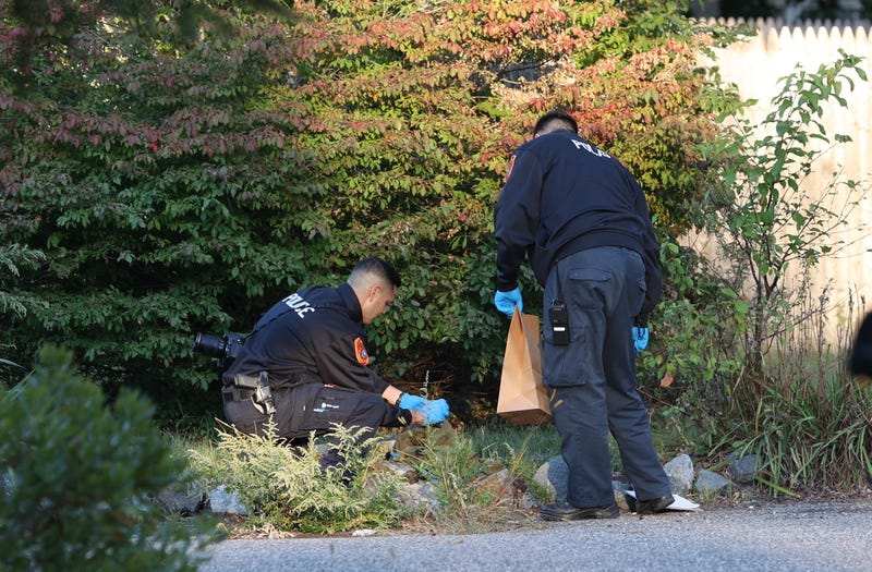 Suffolk County Police Crime Scene Investigators collect evidence after a shooting near Congressman Lee Zeldin's home on St. George Drive in Shirley, New York, on October 9, 2022.