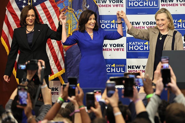 Vice President Kamala Harris, Gov. Kathy Hochul and Secretary Hillary Rodham Clinton hold up their hands at the conclusion of a New York Women “Get Out The Vote” rally at Barnard College on November 03, 2022 in New York City.