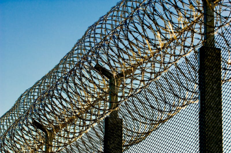 barbed wire prison fence