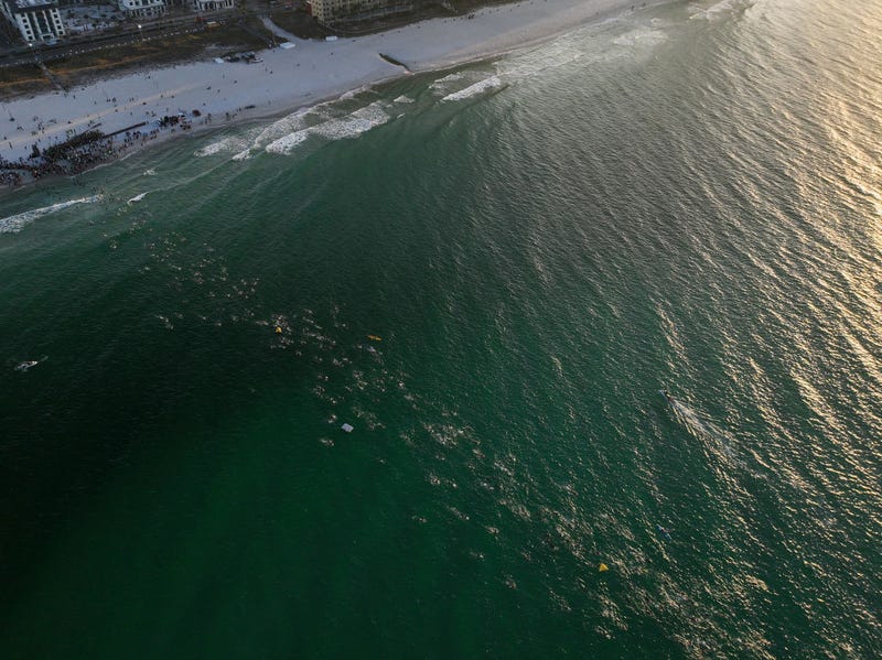 An aerial view of age group athletes competing in the swim course at IRONMAN Florida on November 05, 2022 in Panama City Beach, Florida. (Photo by Patrick McDermott/Getty Images for IRONMAN)