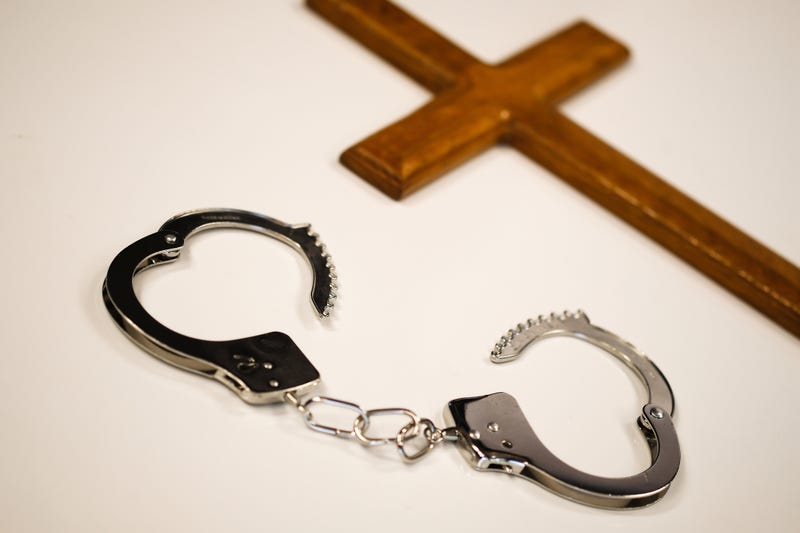 Cross and hancuffs