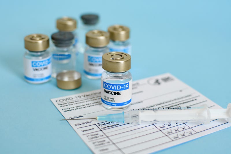 COVID-19 vaccine and vaccine card.