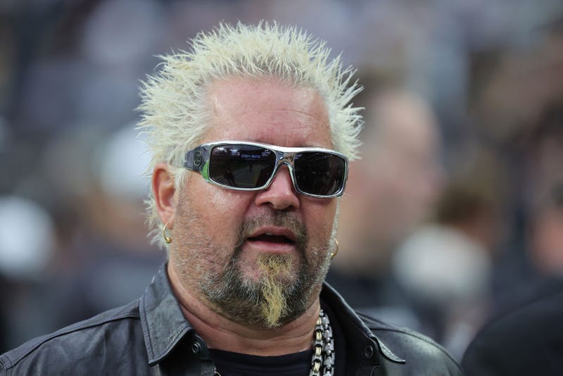 Chef and television personality Guy Fieri talks on the Las Vegas Raiders' sideline