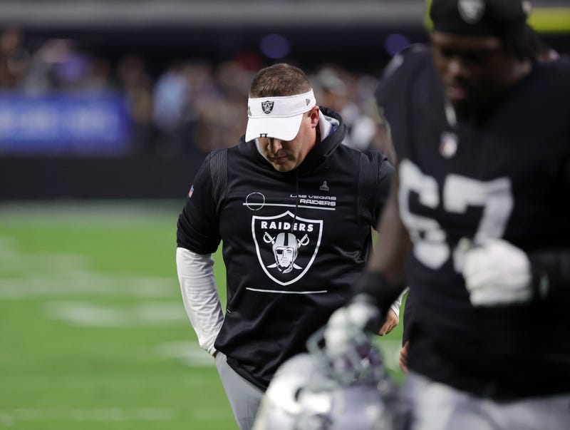 Head coach Josh McDaniels of the Las Vegas Raiders walks off the field after his team's 25-20 loss to the Indianapolis Colts