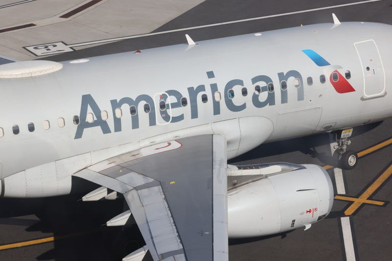 An American Airlines jet moves along the runway at Laguardia AIrport