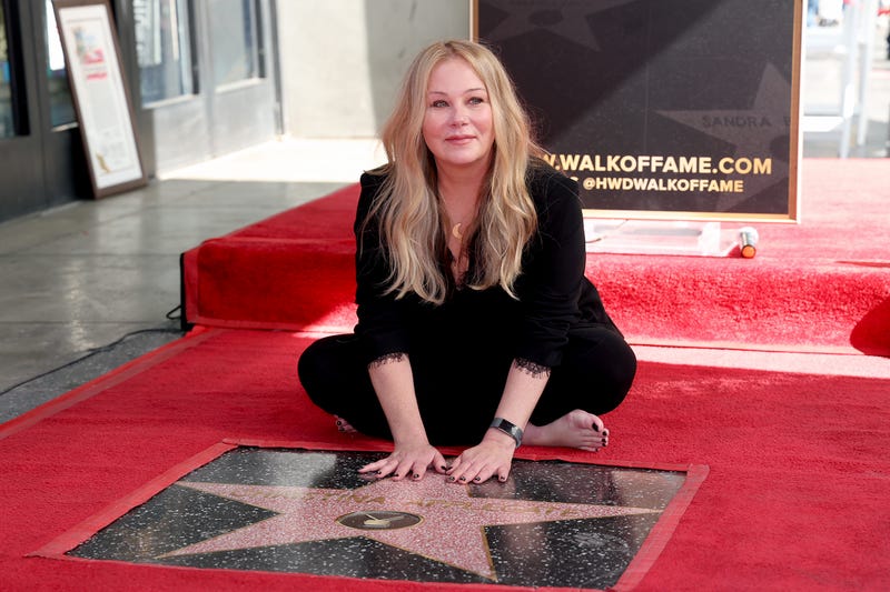Christina Applegate poses with her star during her Hollywood Walk of Fame Ceremony at Hollywood Walk Of Fame on November 14, 2022 in Los Angeles, California. 