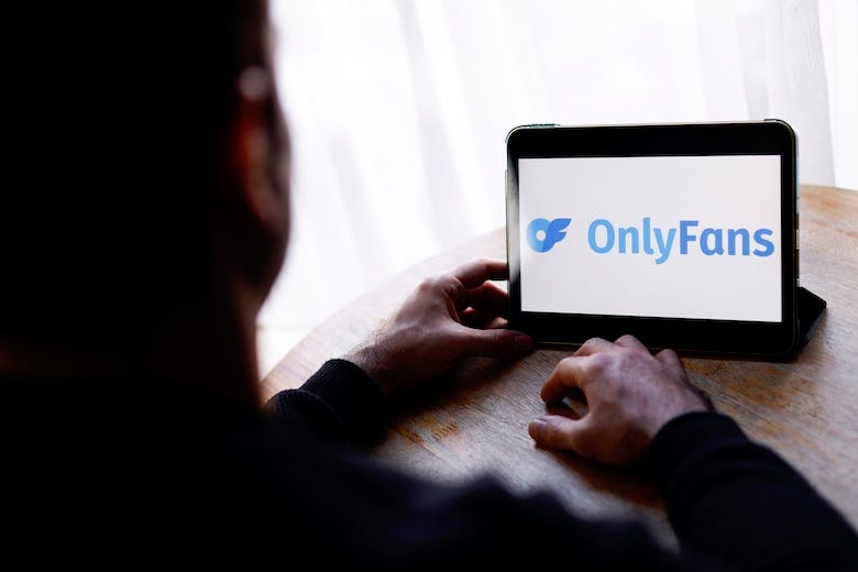 Man visiting OnlyFans website on his tablet
