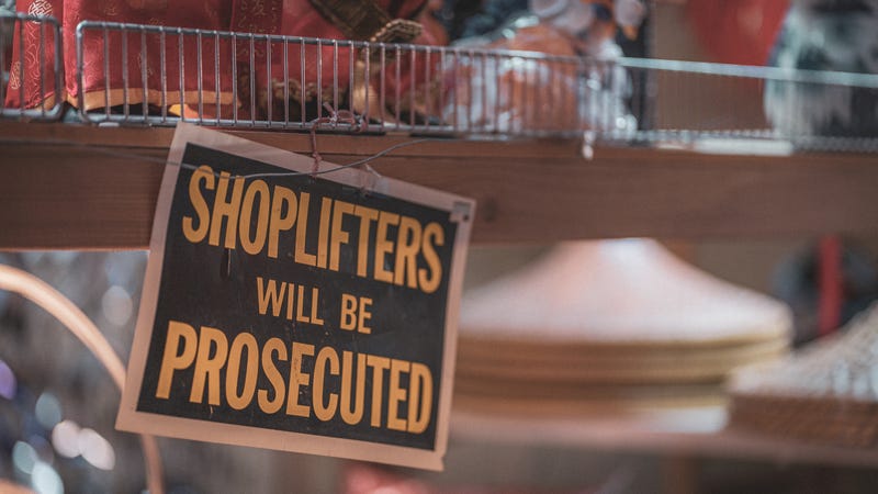 Shoplifters will be prosecuted sign.