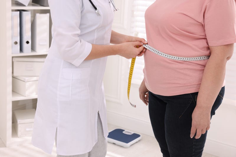 Person being measured for weight loss.