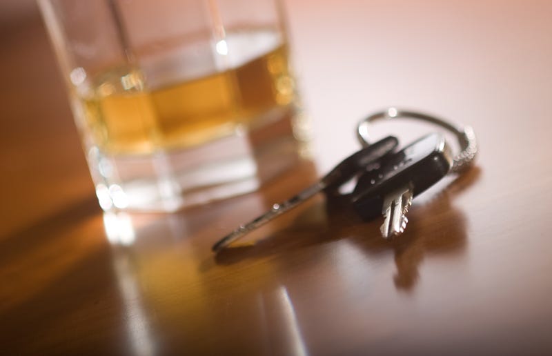 Car keys and a glass of whiskey.