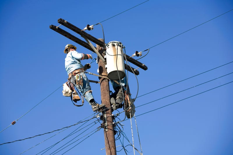 Man working on power pole