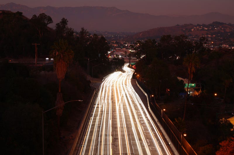 LOS ANGELES, CALIFORNIA - NOVEMBER 23: Vehicle lights are blurred in a long exposure as they make their way along the 110 freeway at dusk on November 23, 2022 in Los Angeles, California.