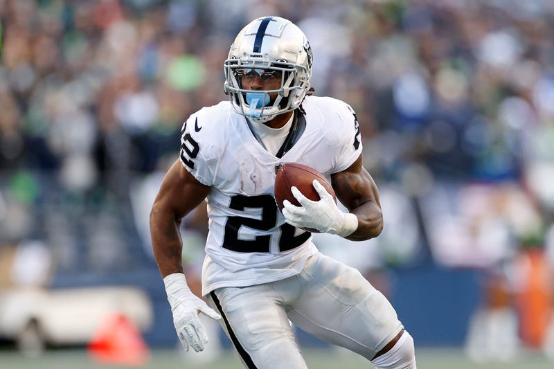 Ameer Abdullah of the Las Vegas Raiders carries the ball during the third quarter against the Seattle Seahawks at Lumen Field on November 27, 2022