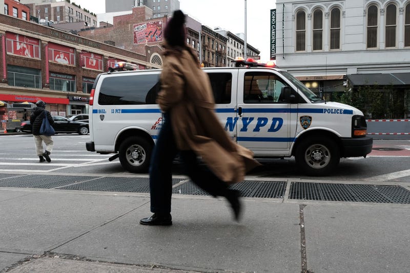 People walk along Canal Street in Manhattan a day after a major police seizure of counterfeit goods in the area on November 29, 2022 in New York City.