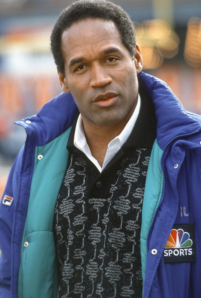 O.J. Simpson looks on before the start of an NFL football game circa 1991. 