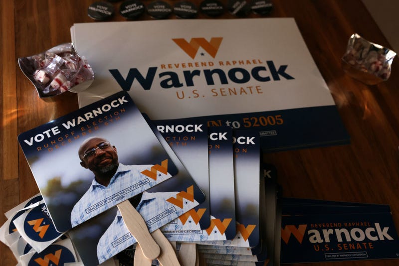 Campaign signs for Georgia Democratic Senate candidate U.S. Sen. Raphael Warnock (D-GA) are seen during a campaign rally on December 2, 2022 in Savannah, Georgia. Sen. Warnock continues to campaign in Georgia for the December 6 runoff election against Republican challenger Herschel Walker. The early voting period finishes at the end of the day. (Photo by Alex Wong/Getty Images)