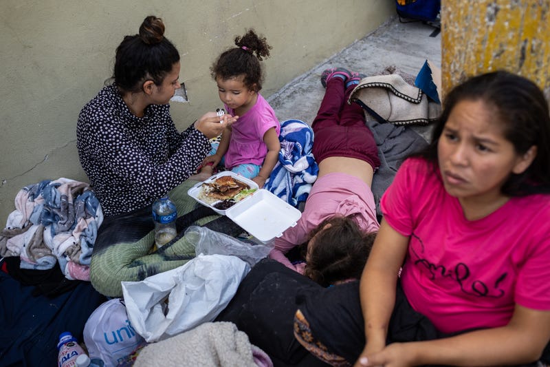 Venezuelan immigrants camp outside on a sidewalk on the Mexican side of the U.S. border on December 2, 2022 in Matamoros, Mexico.