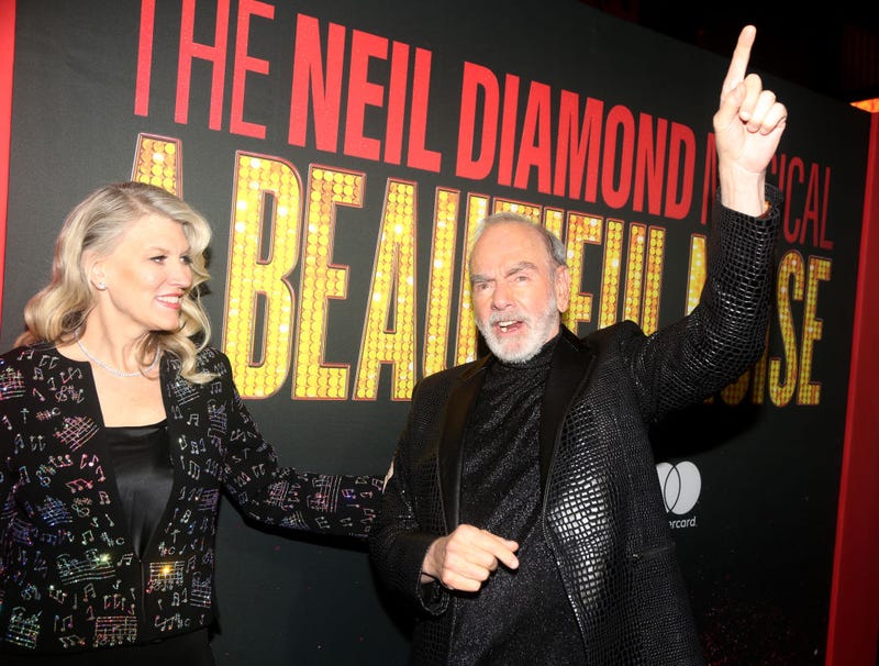 Katie McNeil and Neil Diamond pose at the opening night of the new Neil Diamond musical "A Beautiful Noise" on Broadway at The Broadhurst Theater on December 4, 2022