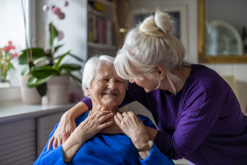Elderly woman with daughter