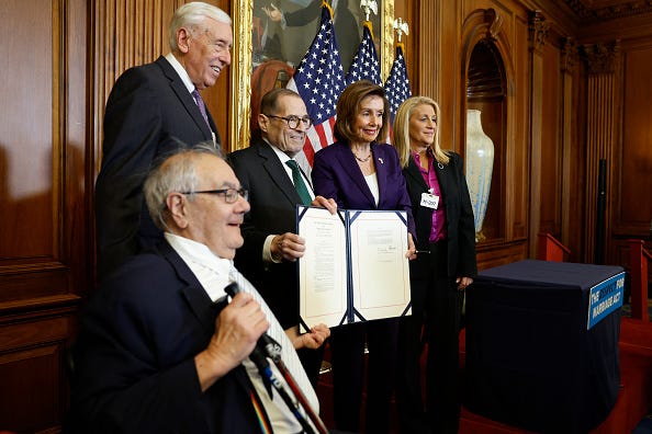 DECEMBER 08: Former Rep. Barney Frank (D-MA) poses for a photo with House Majority Leader Rep. Steny Hoyer (D-MD), Rep. Jerrold Nadler (D-NY), House Speaker Nancy Pelosi (D-CA) and Judith Kasen-Windsor, wife of Edith Windsor, following a bill enrollment ceremony for the Respect For Marriage Act on at the U.S. 