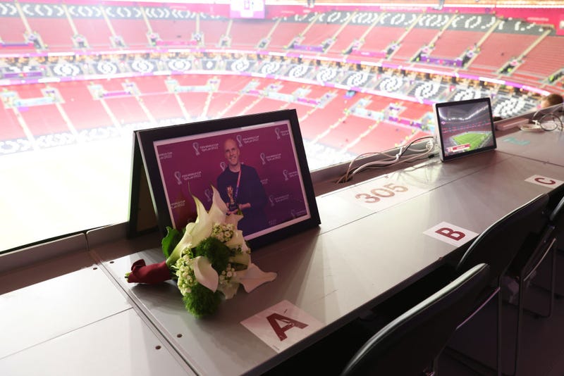 Flowers are placed in memory of Grant Wahl, an American sports journalist who passed away whilst reporting on the Argentina and Netherlands match, prior to the FIFA World Cup Qatar 2022 quarter final match between England and France at Al Bayt Stadium on December 10, 2022 in Al Khor, Qatar. (Photo by Clive Brunskill/Getty Images)