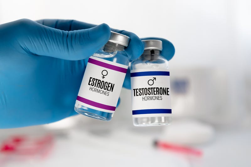 stock photo of estrogen and testosterone hormone vials