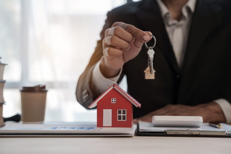 A person buying a home. 