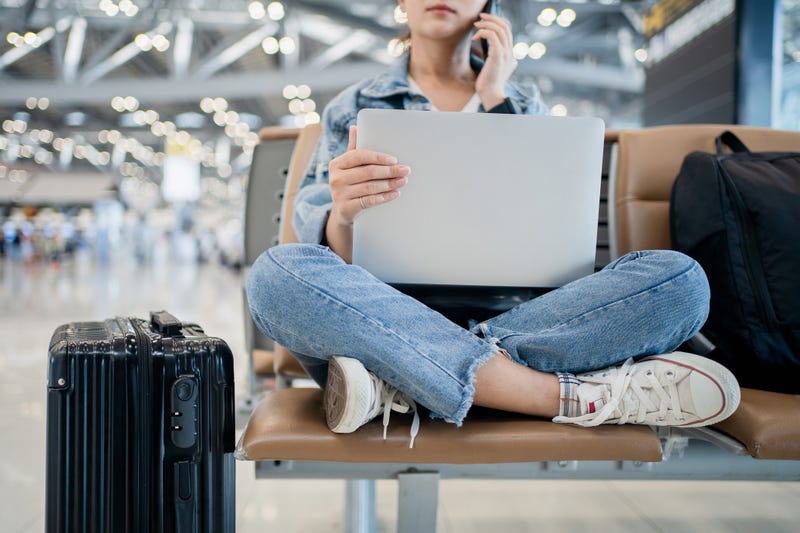 Person surfing the web at an airport.