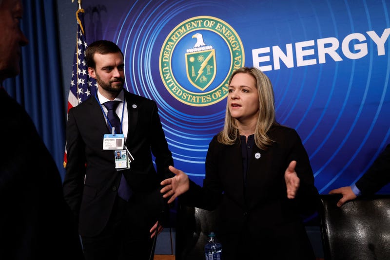 Scientists from the Lawrence Livermore National Laboratories Principal Experimentalist Alex Zylstra (L) and Principal Designer Annie Kritcher talk with guests following a news conference at the Department of Energy headquarters to announce a breakthrough in fusion research on December 13, 2022 in Washington, DC. The officials announced that experiments at the NIF at the LLNL achieved 'ignition,' where the fusion energy generated equals the laser energy that started the reaction for the first time ever, a major advancement that may produce bountiful clean energy in the future. (Photo by Chip Somodevilla/Getty Images)