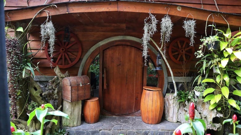 Hobbit House with round doors, barrels, treasure chest, nature plant and other decorations