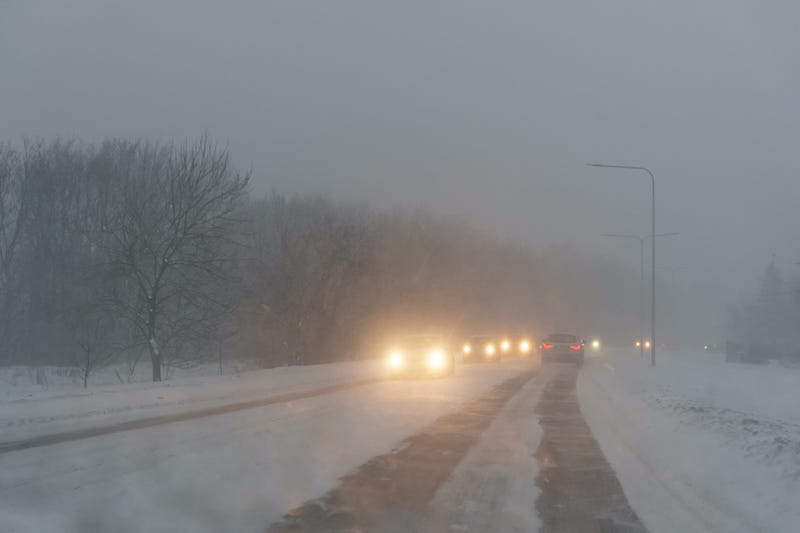 cars driving on snowy road