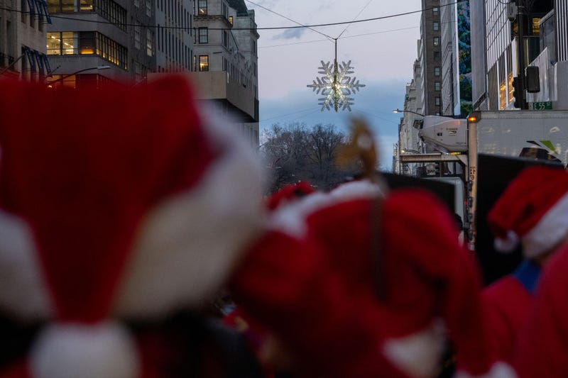 The Holiday Open Streets program stretches to Fifth Ave. and West 57th Street, where a snowflake is suspended 50 feet in the air and lit up.