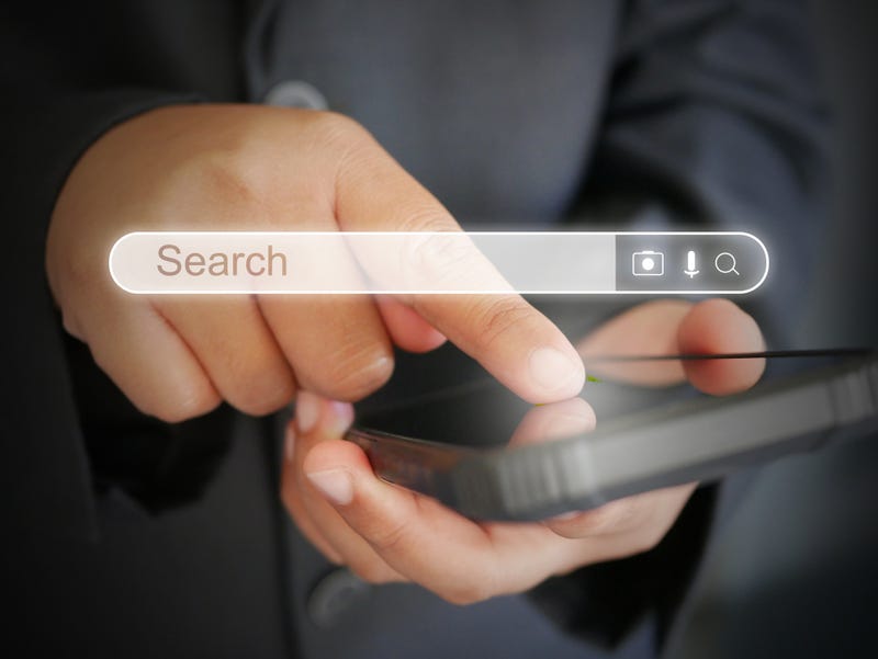 Person searching something on their phone.