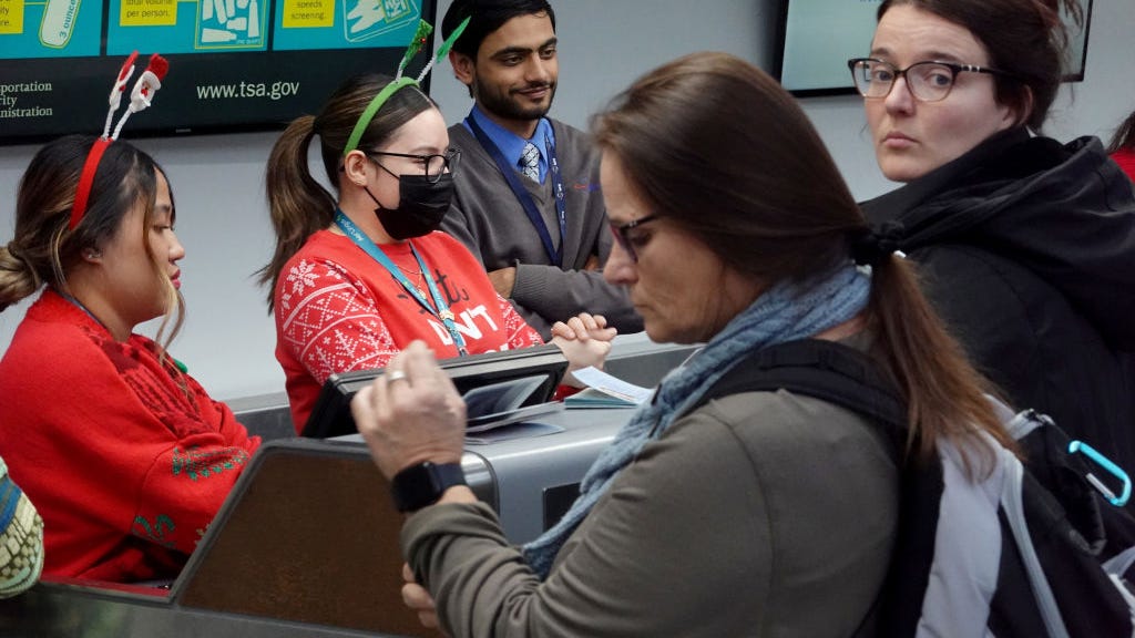 Here’s the latest on holiday travel snafus: thousands of flights canceled, airports stalled