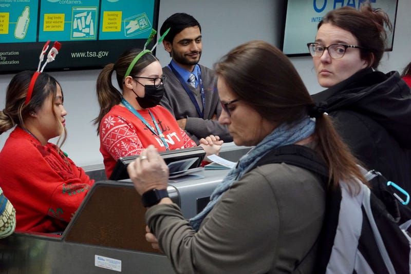 Travelers check in for flights at O'Hare International Airport on December 22, 2022 in Chicago, Illinois. A winter weather system bringing snow, high winds, and sub-zero temperatures has wreaked havoc on holiday travel during one of the busiest days of the year for airlines. As of 8:00 AM more than 400 flights out O'Hare had been cancelled. (Photo by Scott Olson/Getty Images)