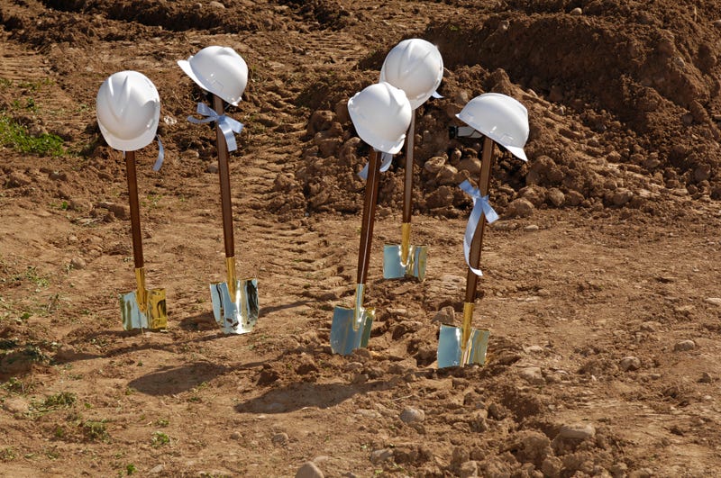 Construction shovels at a groundbreaking.