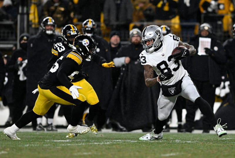 Darren Waller #83 of the Las Vegas Raiders tries to evade a tackle during the third quarter against the Pittsburgh Steelers at Acrisure Stadium on December 24, 2022 in Pittsburgh, Pennsylvania